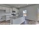 Modern kitchen with granite countertops, stainless steel appliances, and a spacious kitchen island at 3905 Coleman Dr, Charlotte, NC 28215