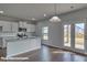 Modern kitchen with granite countertops, stainless steel appliances, a kitchen island, and french doors at 3905 Coleman Dr, Charlotte, NC 28215