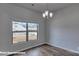 Light-filled living room featuring wood-look floors and a large window at 3905 Coleman Dr, Charlotte, NC 28215