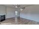 Spacious living room featuring a fireplace, ceiling fan, and wood-look flooring at 3905 Coleman Dr, Charlotte, NC 28215