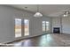 Spacious living room featuring hardwood floors, fireplace and access to backyard at 3905 Coleman Dr, Charlotte, NC 28215