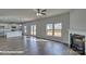 Open-concept living area, with a fireplace, kitchen, and french doors at 3905 Coleman Dr, Charlotte, NC 28215
