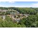 Aerial view of a neighborhood with mature trees and well-maintained lawns at 4729 Nijinsky Ct, Charlotte, NC 28216