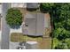 Aerial view of home with mature trees, driveway, and partial lawn at 4729 Nijinsky Ct, Charlotte, NC 28216