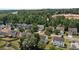 A beautiful aerial view of a suburban neighborhood with well-maintained homes and lush green trees at 4729 Nijinsky Ct, Charlotte, NC 28216