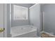 Bathroom with a soaker tub and a separate shower with modern shower door at 4729 Nijinsky Ct, Charlotte, NC 28216