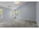 Spacious bedroom with vaulted ceiling, neutral carpet, and natural light from two windows at 4729 Nijinsky Ct, Charlotte, NC 28216