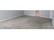 Carpeted bedroom with neutral walls and trim with doorway to hallway and/or other room at 4729 Nijinsky Ct, Charlotte, NC 28216