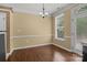 Dining room with hardwood floors, a chandelier, and a window at 4729 Nijinsky Ct, Charlotte, NC 28216