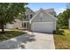 Charming two-story home with a well-maintained lawn and an attached two-car garage at 4729 Nijinsky Ct, Charlotte, NC 28216