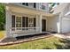 Welcoming front porch featuring a classic design with white columns and decorative landscaping, enhancing curb appeal at 4729 Nijinsky Ct, Charlotte, NC 28216