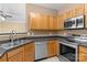 Well-lit kitchen with stainless steel appliances and updated countertops at 4729 Nijinsky Ct, Charlotte, NC 28216