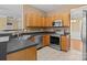 Well-equipped kitchen with stainless steel appliances and tile flooring at 4729 Nijinsky Ct, Charlotte, NC 28216