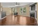 Spacious living room with hardwood floors and a cozy fireplace at 4729 Nijinsky Ct, Charlotte, NC 28216