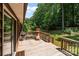 Wooden back deck with sliding glass door access, features a grill and outdoor seating for entertaining at 503 Overbrook Dr, Albemarle, NC 28001