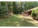 Overhead view of an expansive backyard with a shed, outdoor seating, and a large grassy area, great for entertaining at 503 Overbrook Dr, Albemarle, NC 28001