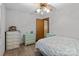Bedroom featuring light gray walls, ceiling fan, wood-look floors, and vintage furniture at 503 Overbrook Dr, Albemarle, NC 28001