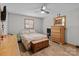 Bedroom featuring a ceiling fan, window, light-colored walls and hardwood floors at 503 Overbrook Dr, Albemarle, NC 28001