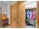 Walk-in closet with wood-look flooring and shelves with many articles of clothing at 503 Overbrook Dr, Albemarle, NC 28001