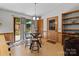 Charming dining area with glass table, backyard views, and seamless access to the deck at 503 Overbrook Dr, Albemarle, NC 28001