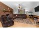 Inviting living room featuring a brick fireplace, comfortable seating, and natural light at 503 Overbrook Dr, Albemarle, NC 28001