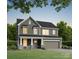 Charming two-story home with a welcoming front porch and attached two-car garage at 5112 Izzo Ln, Charlotte, NC 28214