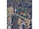 An aerial view shows a property surrounded by mature trees, other homes, and nearby roads at 6215 Simpson Rd, Charlotte, NC 28216