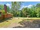Spacious backyard with concrete patio, brick home, and gazebo at 6215 Simpson Rd, Charlotte, NC 28216