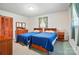 Cozy bedroom with two beds, matching furniture set, and window views at 6215 Simpson Rd, Charlotte, NC 28216