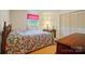 Inviting bedroom with a floral bedspread and a well-lit window at 6215 Simpson Rd, Charlotte, NC 28216