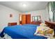Bedroom with two twin beds, vintage furniture, and wood accents at 6215 Simpson Rd, Charlotte, NC 28216