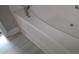This bathroom features a relaxing soaking tub with tile flooring and modern fixtures at 632 Pawley Dr, Charlotte, NC 28214