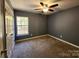 Bedroom featuring neutral carpet, a window and a ceiling fan at 632 Pawley Dr, Charlotte, NC 28214