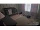 Cozy bedroom with pink rug, curtains, and a baby crib at 632 Pawley Dr, Charlotte, NC 28214