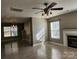 Living room features hard wood flooring and a fireplace with windows on either side at 632 Pawley Dr, Charlotte, NC 28214