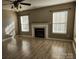 Bright living room features hardwood floors, fireplace and plenty of natural light at 632 Pawley Dr, Charlotte, NC 28214