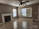 Living room featuring hard wood floors, a fireplace and windows at 632 Pawley Dr, Charlotte, NC 28214