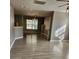 Spacious living room with hard wood flooring, large window and view into the kitchen at 632 Pawley Dr, Charlotte, NC 28214