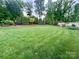 Expansive backyard with lush green lawn and privacy landscaping at 67 41St Nw Ave # 3, Hickory, NC 28601