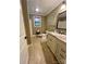 Well-lit bathroom with a granite countertop vanity and neutral-toned walls at 67 41St Nw Ave # 3, Hickory, NC 28601
