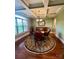 A formal dining room features coffered ceilings, elegant furniture, and natural light from large windows at 67 41St Nw Ave # 3, Hickory, NC 28601
