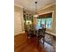 Cozy dining area with built-in cabinets, natural light, and elegant lighting fixture at 67 41St Nw Ave # 3, Hickory, NC 28601