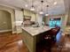 Kitchen features a large island with seating, pendant lighting, and modern appliances at 67 41St Nw Ave # 3, Hickory, NC 28601