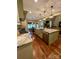 Spacious kitchen island with stainless steel sink, seating, and views into the living area at 67 41St Nw Ave # 3, Hickory, NC 28601