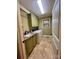 Well-equipped laundry room with modern washer, dryer, sink, and cabinets at 67 41St Nw Ave # 3, Hickory, NC 28601