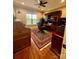 Office boasting hardwood floors, a desk, bookshelves, and a ceiling fan at 67 41St Nw Ave # 3, Hickory, NC 28601