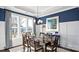 Beautiful dining room featuring a modern chandelier, stylish decor, and lots of natural light at 7017 Treetop Ct, York, SC 29745