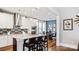 Well-appointed kitchen with stainless appliances, granite countertops, eat-in island, and adjacent dining area at 7017 Treetop Ct, York, SC 29745