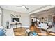 Open concept living room and kitchen featuring a tv, hardwood floors and a view of the open floor plan at 7017 Treetop Ct, York, SC 29745