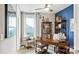Bright office featuring a blue accent wall, a ceiling fan, and a large desk at 7017 Treetop Ct, York, SC 29745